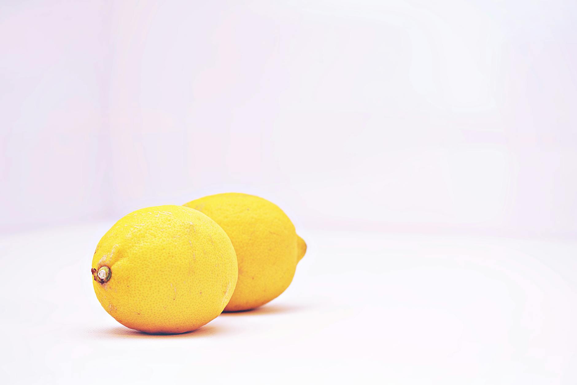 Fresh bright lemons on white background symbolizing renewal and fresh starts