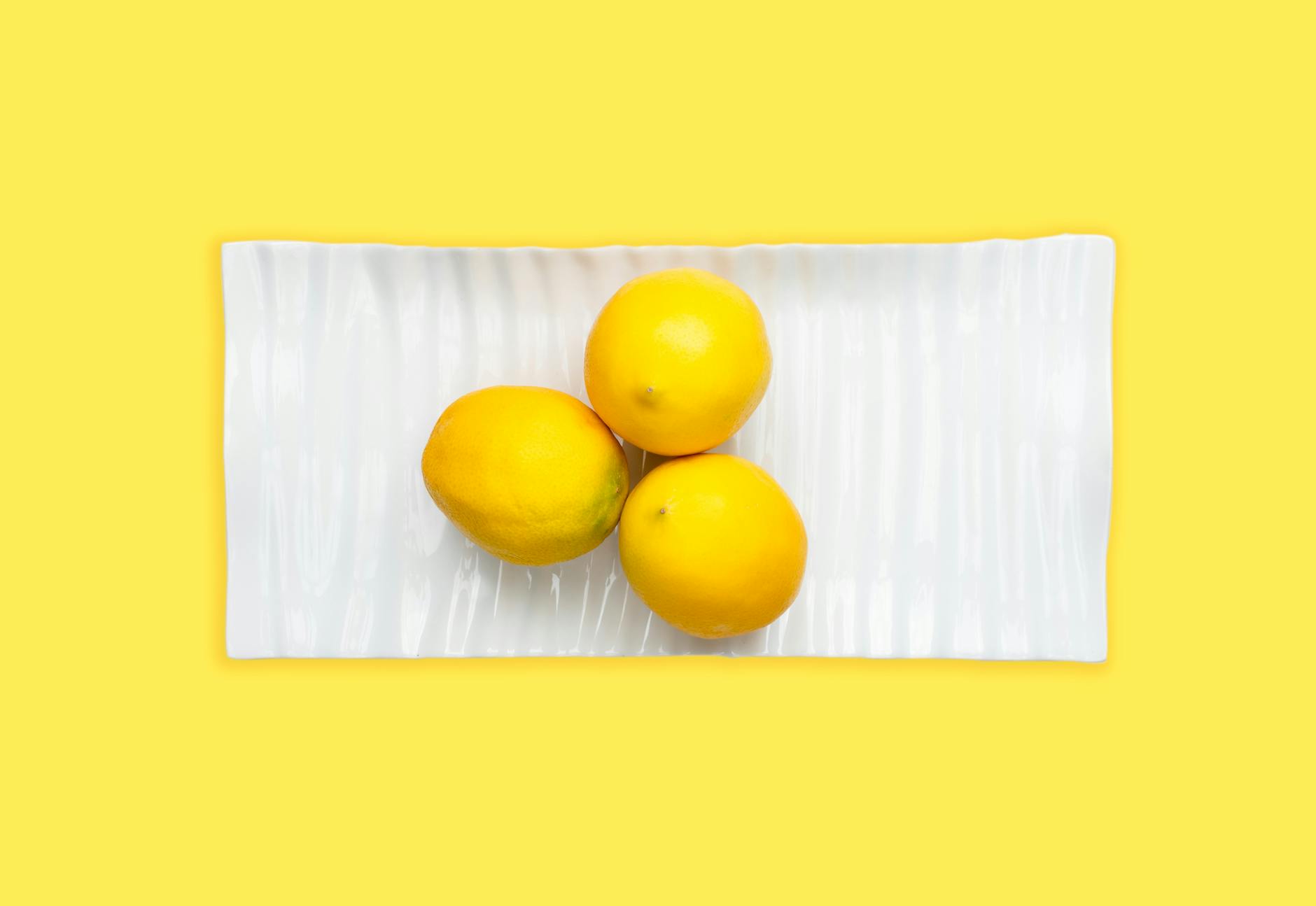 Vibrant adult toys arranged on bright yellow surface